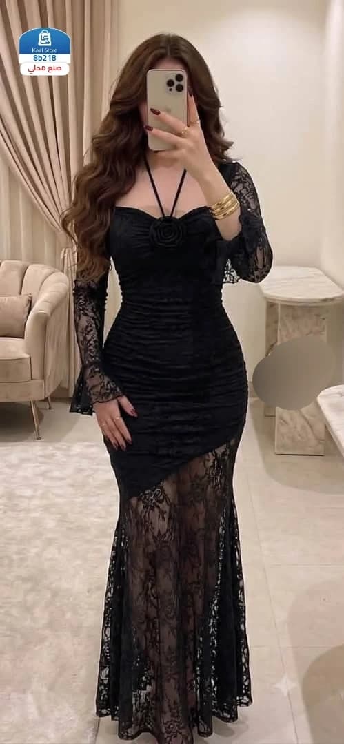 فستان أسود بتصميم أنثوي راقٍ - صورة 1